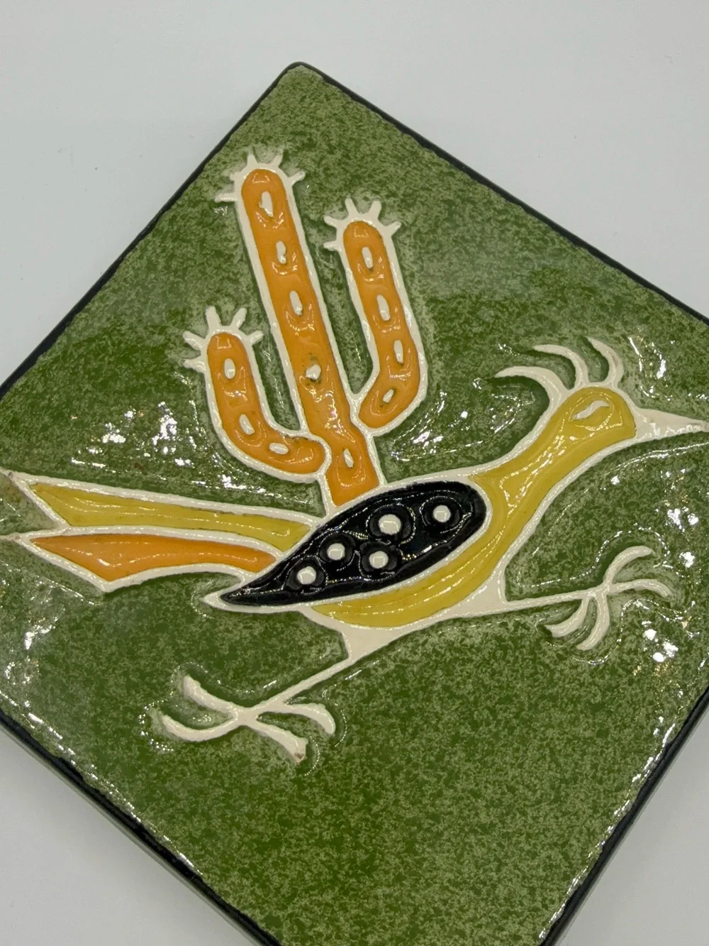 Vintage Legendware handcrafted ceramic roadrunner and cactus trivet.